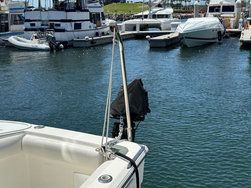 Slide: The Image of 2003 Mediterranean 38 Convertible yacht docked in a marina with other boats. - 16