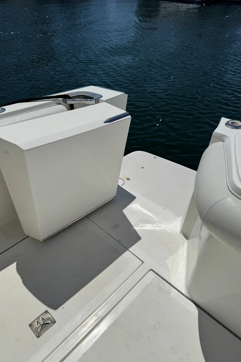 Slide: The Image of 2003 Mediterranean 38 Convertible yacht deck with white seating and water view. - 26
