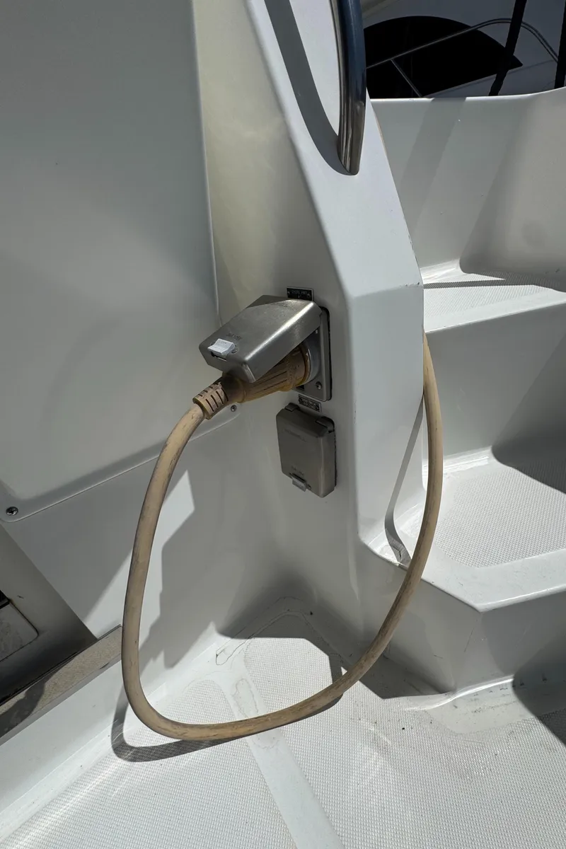 Slide: The Image of Power outlet on 2003 Mediterranean 38 Convertible boat with cable connected. - 29