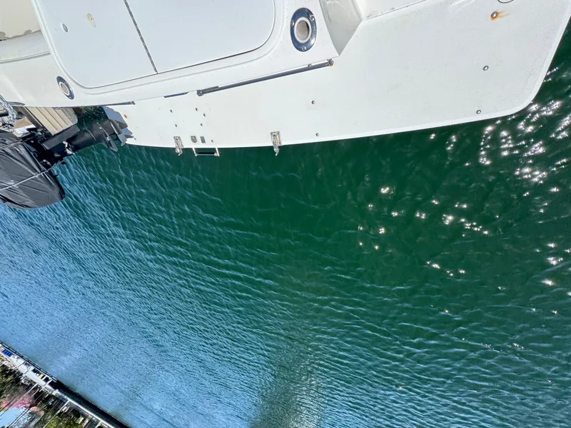 Slide: The Image of Aerial view of a 2003 Mediterranean 38 Convertible yacht on clear water. - 30