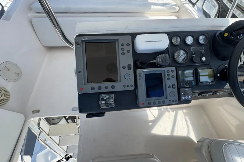 Slide: The Image of Control panel of a 2003 Mediterranean 38 Convertible yacht with navigation instruments. - 32