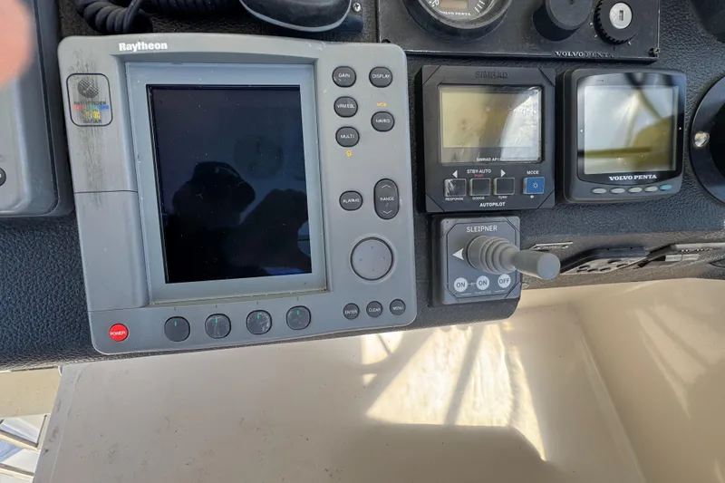 Slide: The Image of Control panel of a 2003 Mediterranean 38 Convertible boat with navigation equipment. - 34