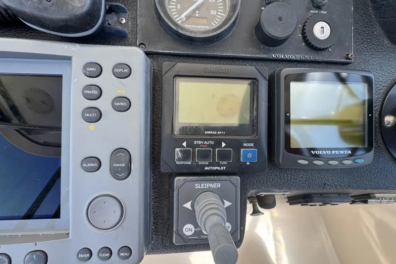 Slide: The Image of Control panel of a 2003 Mediterranean 38 Convertible boat with navigation instruments. - 36