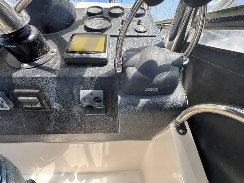 Slide: The Image of Control panel of a 2003 Mediterranean 38 Convertible boat with gauges and switches. - 38