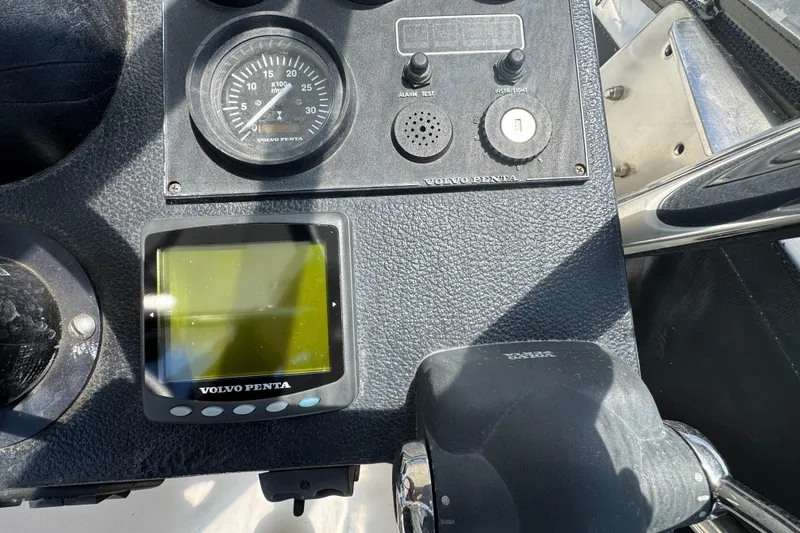 Slide: The Image of Control panel of a 2003 Mediterranean 38 Convertible boat with Volvo Penta display. - 39