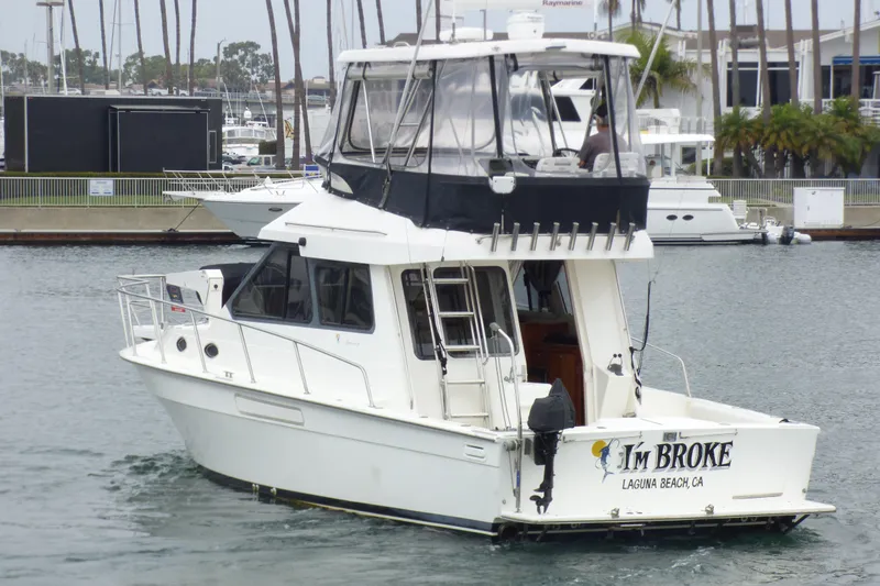 Slide: The Image of 2003 Mediterranean 38 Convertible yacht in marina, named "I'm Broke," Laguna Beach, CA. - 4