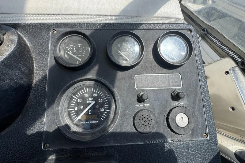 Slide: The Image of Instrument panel of a 2003 Mediterranean 38 Convertible boat with gauges and controls. - 40