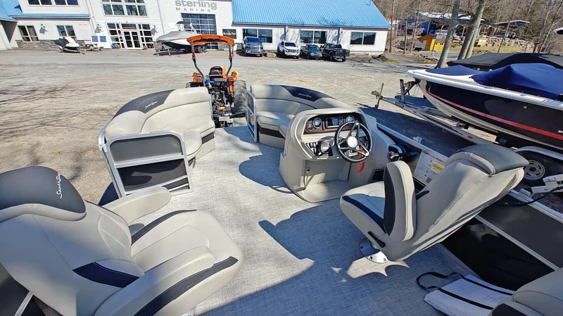 Slide: The Image of Interior of 2022 South Bay 200 Series S222RS 2.75 pontoon boat at marina. - 11