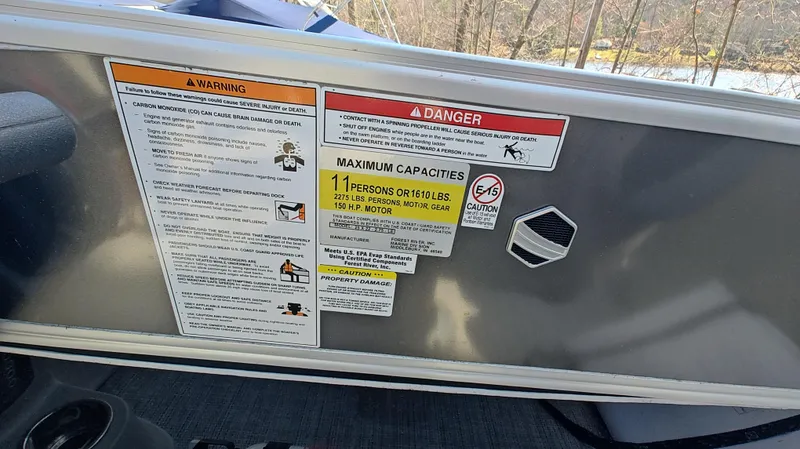 Slide: The Image of Warning and capacity labels on 2022 South Bay 200 Series S222RS 2.75 boat. - 6