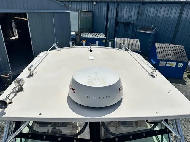 Slide: The Image of Rooftop view of a 2001 Parker 2510DVWA boat with radar equipment. - 15