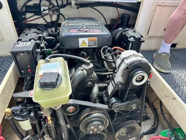 Slide: The Image of Engine compartment of a 2001 Parker 2510DVWA boat, showcasing mechanical components and wiring. - 22