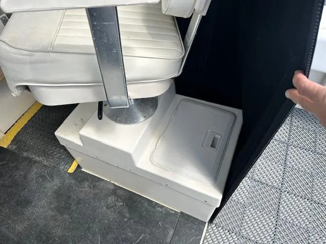 Slide: The Image of Boat interior with white seat and storage compartment, Parker 2510DVWA, 2001 model. - 9