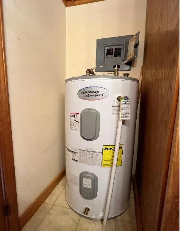 Slide: The Image of American Standard water heater in a 1990 custom houseboat corner installation. - 17
