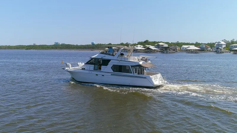 Slide: The Image of Navigator 5600 Sundance Pilothouse yacht cruising on a sunny day, 1997 model. - 22