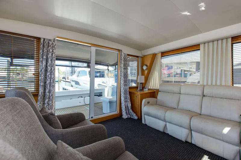 Slide: The Image of Luxurious interior of 1997 Navigator 5600 Sundance Pilothouse with plush seating and large windows. - 44