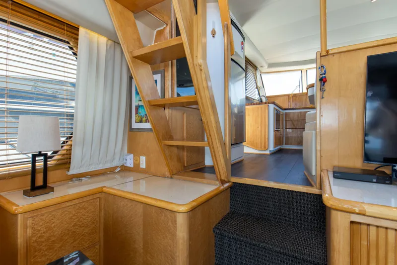 Slide: The Image of Interior of 1997 Navigator 5600 Sundance Pilothouse with wooden finishes and modern decor. - 46