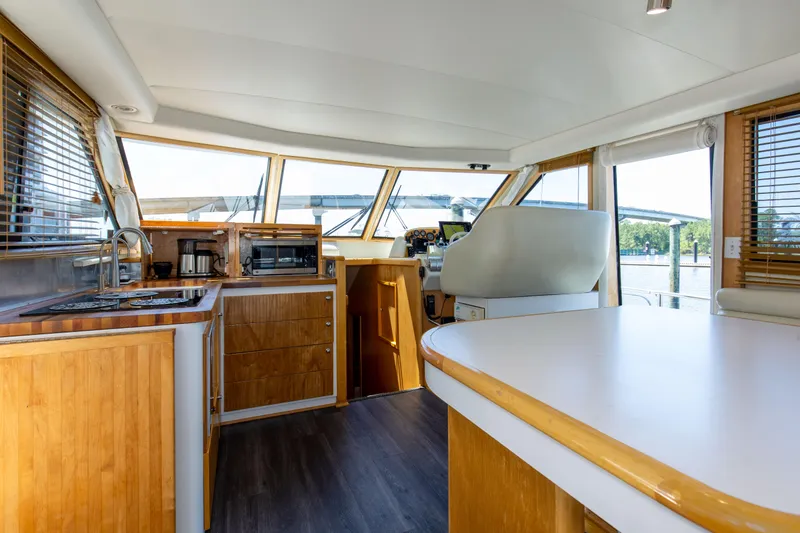 Slide: The Image of Interior of 1997 Navigator 5600 Sundance Pilothouse with modern kitchen and helm station. - 47