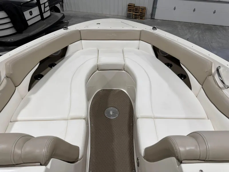 Slide: The Image of 2013 Sea Ray 300 SLX boat interior with white and beige seating. - 15