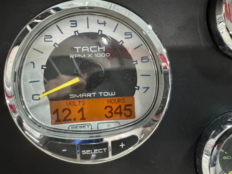 Slide: The Image of Tachometer of 2013 Sea Ray 300 SLX showing 12.1 volts and 345 hours. - 17