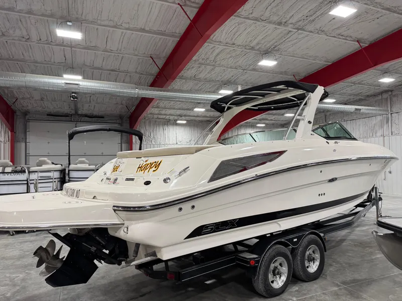 Slide: The Image of 2013 Sea Ray 300 SLX boat on trailer in indoor storage facility. - 4