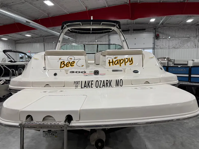 Slide: The Image of 2013 Sea Ray 300 SLX boat with "Bee Happy" text, docked in Lake Ozark, MO. - 5