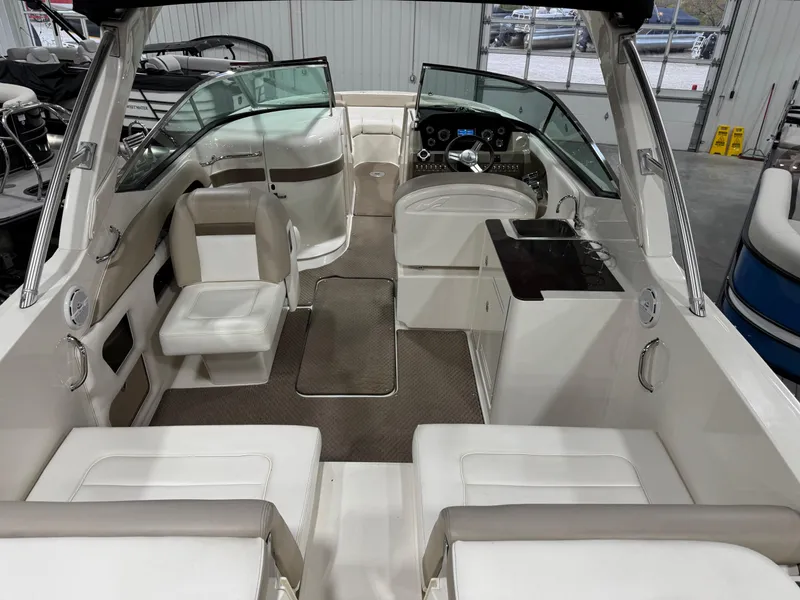 Slide: The Image of Interior of 2013 Sea Ray 300 SLX boat with seating and control panel. - 7