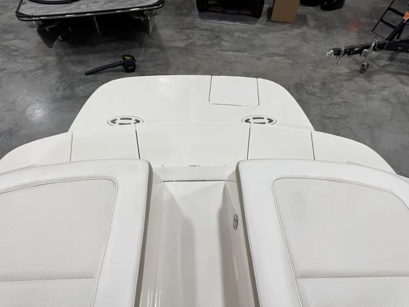 Slide: The Image of 2013 Sea Ray 300 SLX boat interior with white seating and deck. - 8
