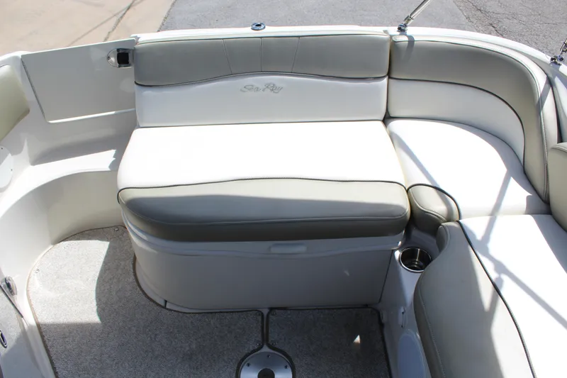 Slide: The Image of 2007 Sea Ray 240 Sundeck interior seating with white and gray upholstery. - 15