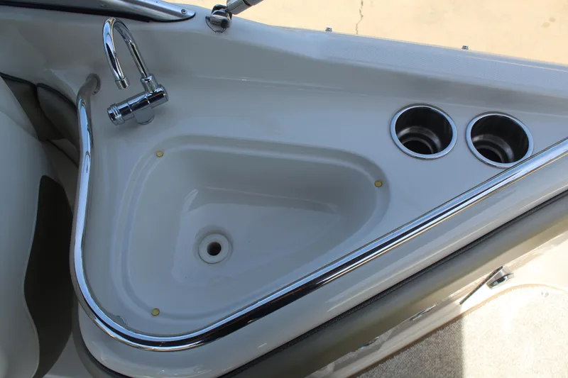 Slide: The Image of 2007 Sea Ray 240 Sundeck sink and cup holders on deck. - 17