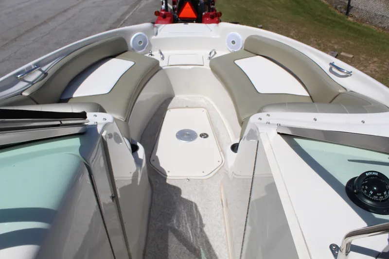 Slide: The Image of 2007 Sea Ray 240 Sundeck interior with cushioned seating and compass. - 19