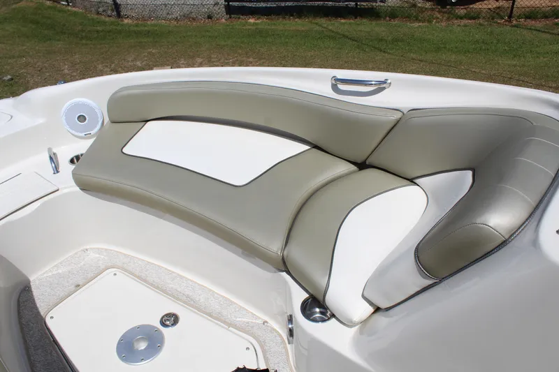 Slide: The Image of 2007 Sea Ray 240 Sundeck interior seating with beige and white upholstery. - 21