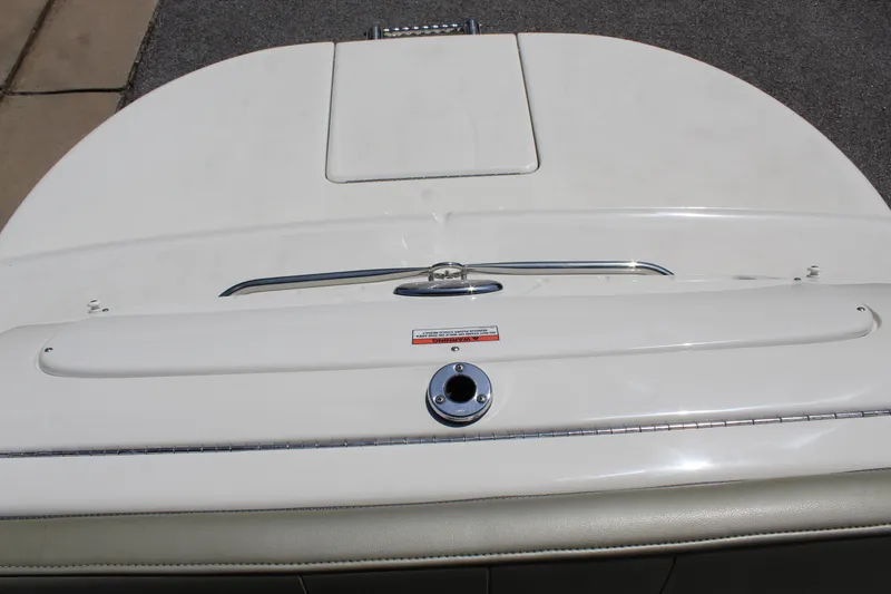 Slide: The Image of 2007 Sea Ray 240 Sundeck boat deck, featuring a sleek white finish and stainless steel details. - 23