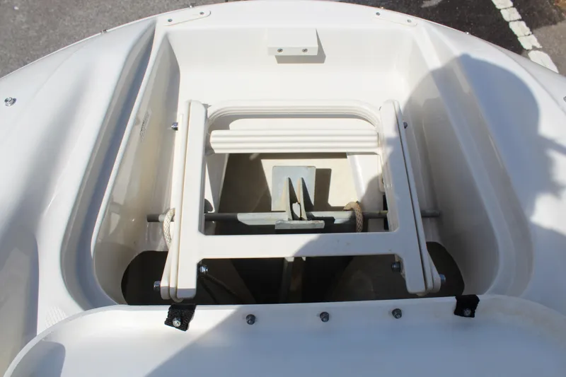 Slide: The Image of 2007 Sea Ray 240 Sundeck anchor storage compartment, featuring a neatly secured anchor. - 24
