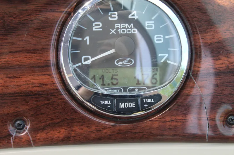 Slide: The Image of Close-up of 2007 Sea Ray 240 Sundeck RPM gauge displaying 11.5 volts and 176 hours. - 26