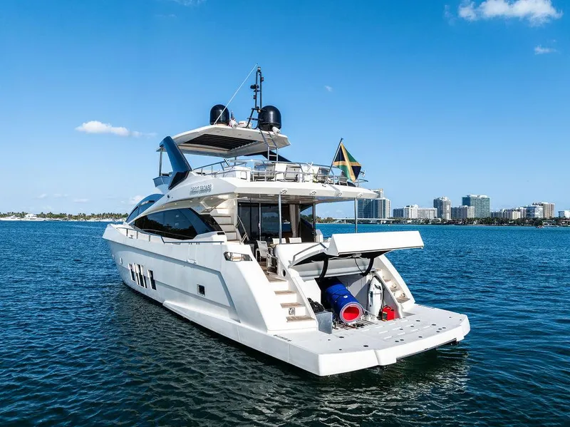 Slide: The Image of Luxury 2013 Astondoa 72 GLX yacht on water with city skyline in background. - 13