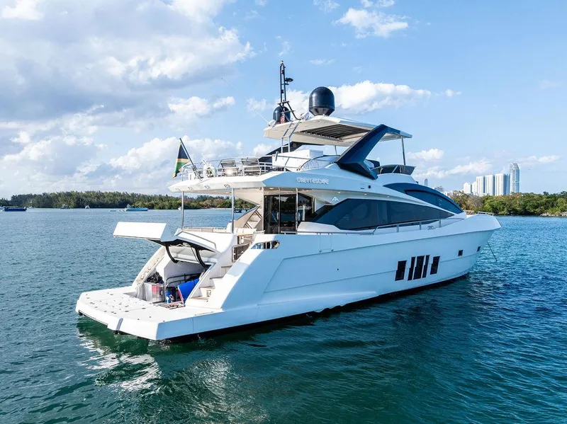 Slide: The Image of Luxury 2013 Astondoa 72 GLX yacht cruising on a sunny day, with city skyline in background. - 14