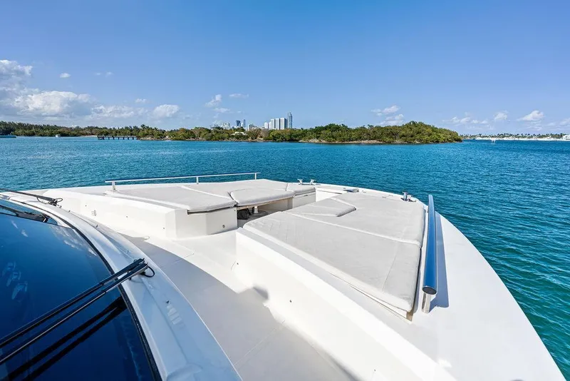Slide: The Image of Astondoa 72 GLX yacht deck, 2013 model, cruising on clear blue waters. - 17