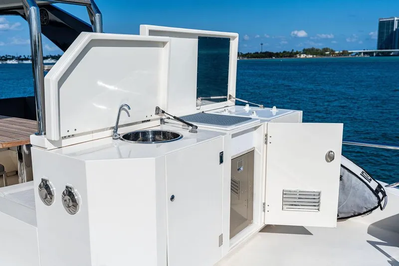 Slide: The Image of Outdoor kitchen on 2013 Astondoa 72 GLX yacht with sink and storage, overlooking water. - 25
