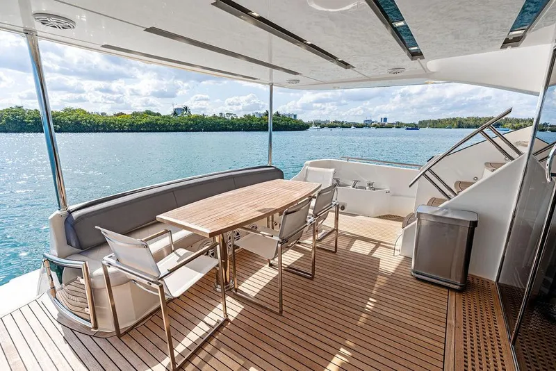 Slide: The Image of Astondoa 72 GLX 2013 yacht deck with dining area overlooking serene water. - 35