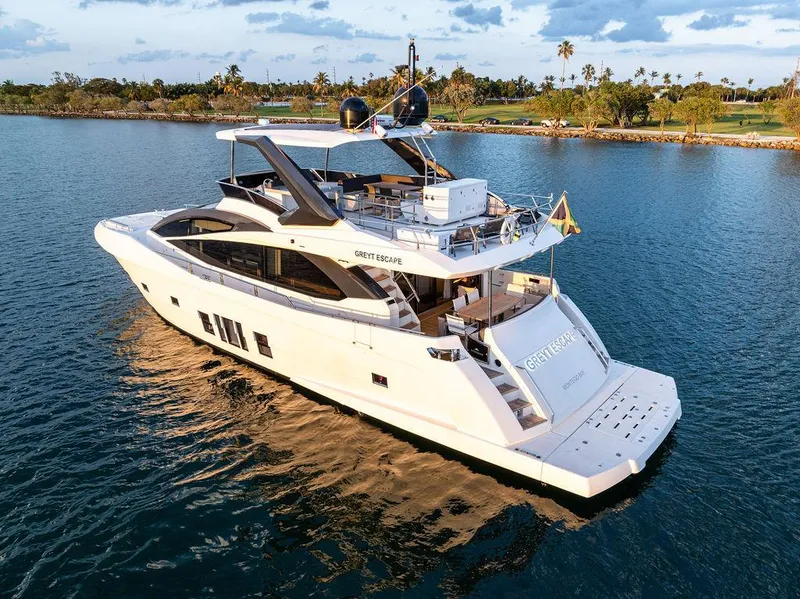 Slide: The Image of Astondoa 72 GLX 2013 yacht cruising on serene waters at sunset. - 4