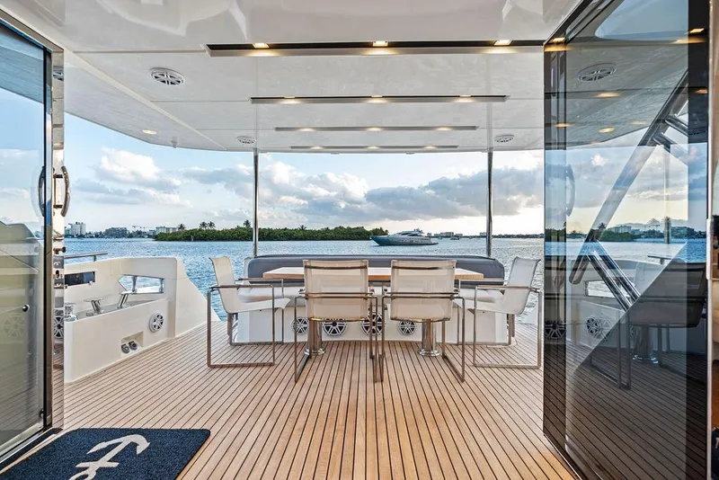 Slide: The Image of Luxurious 2013 Astondoa 72 GLX yacht deck with elegant dining area and scenic ocean view. - 40