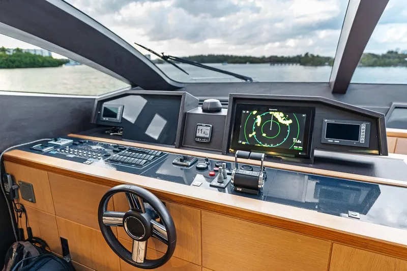 Slide: The Image of Helm of 2013 Astondoa 72 GLX yacht with navigation screens and steering wheel. - 49