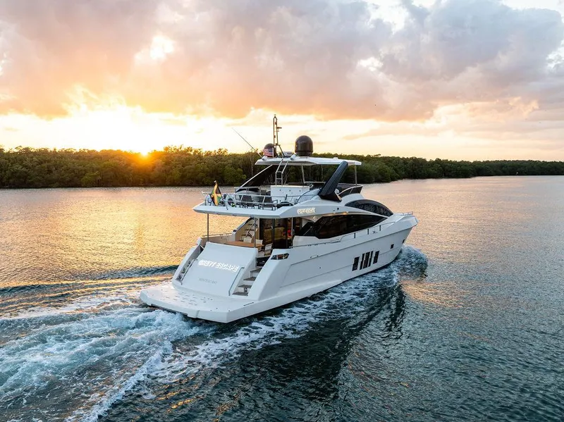 Slide: The Image of Astondoa 72 GLX yacht cruising at sunset, 2013 model, serene water backdrop. - 5