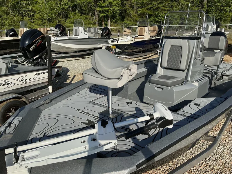 Slide: The Image of 2025 Xpress Hyper-Lift Series H20B boat with new console, parked outdoors. - 3