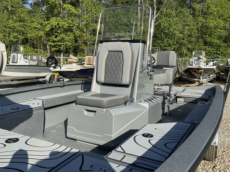 Slide: The Image of 2025 Xpress Hyper-Lift Series H20B boat with new console, in a wooded outdoor setting. - 4