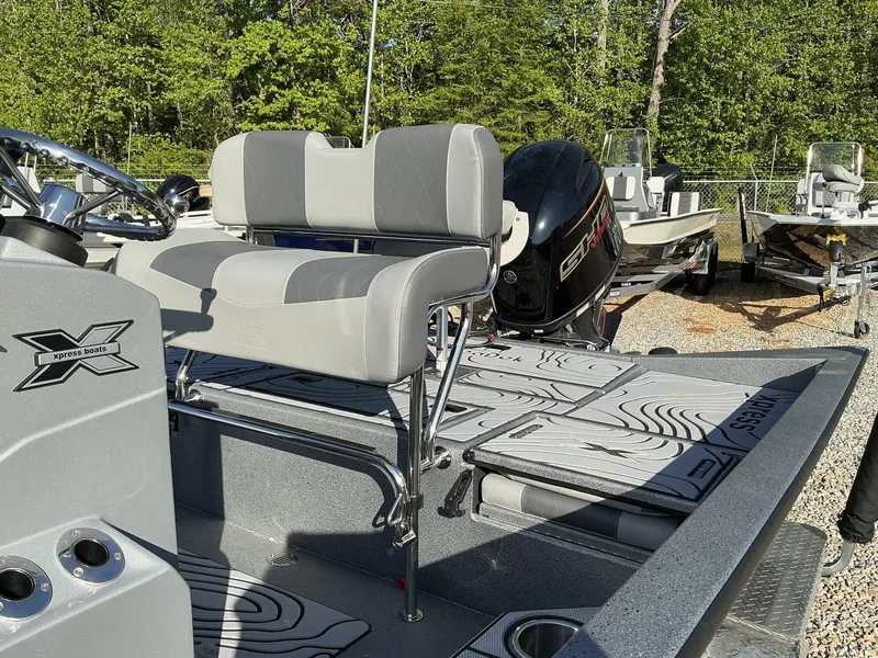 Slide: The Image of 2025 Xpress Hyper-Lift Series H20B boat with new console, featuring sleek seating and powerful engine. - 8