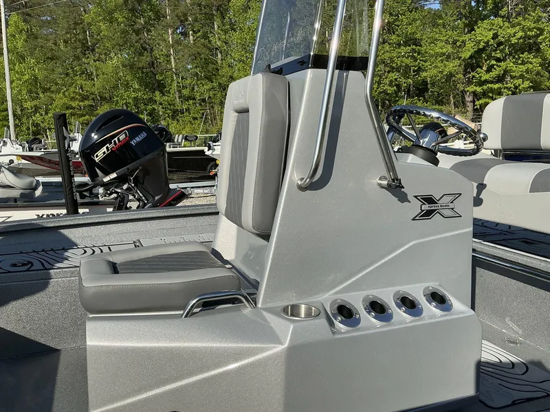 Slide: The Image of 2025 Xpress Hyper-Lift Series H20B boat console with seating and Yamaha outboard motor. - 9