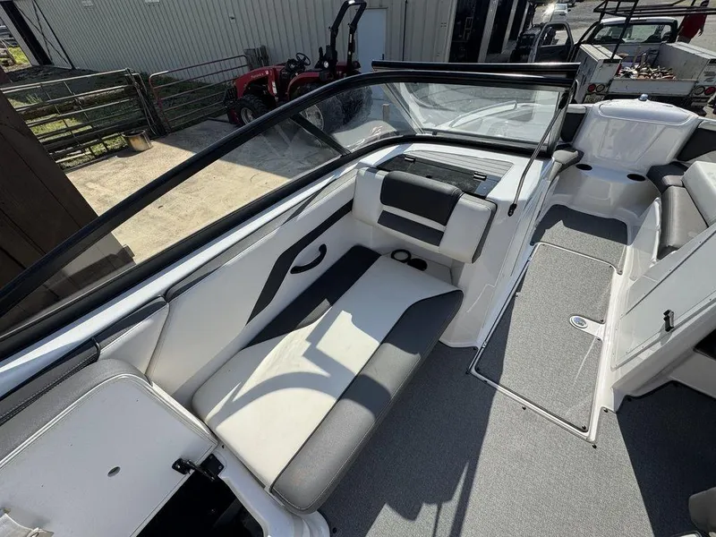 Slide: The Image of 2020 Yamaha AR210 boat interior with seating and windshield, showcasing modern design. - 9