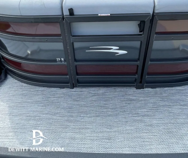 Slide: The Image of 2023 Bennington Marine 25RFBST pontoon boat rear view with logo and flooring. - 9