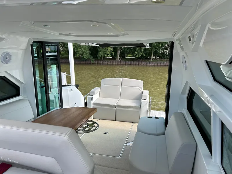 Slide: The Image of Luxurious interior of 2019 Beneteau Gran Turismo 46 yacht with elegant seating and table. - 10